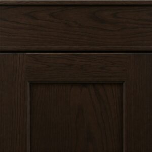 Detailed view of a dark brown kitchen cabinets door, highlighting the wood grain and finish.