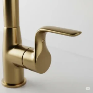 Brushed brass kitchen faucet handle ergonomic design for contemporary kitchens.