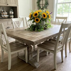 farmhouse kitchen table and chairs set with a natural centerpiece.