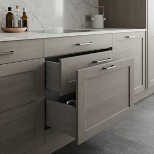 Frameless kitchen cabinets featuring soft-close drawers for efficient storage.