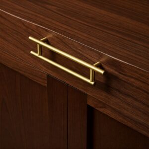 Elegant gold Modern Kitchen Cabinet Pulls on a dark wood kitchen cabinet.