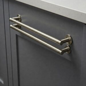 Modern gray kitchen cabinet hardware details: brushed nickel handles.
