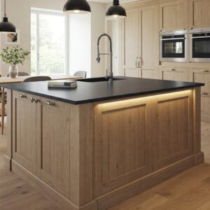 Kitchen island showcasing light brown kitchen cabinets and a contrasting countertop.
