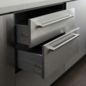 Close-up of spacious drawers in a stainless kitchen cabinet.