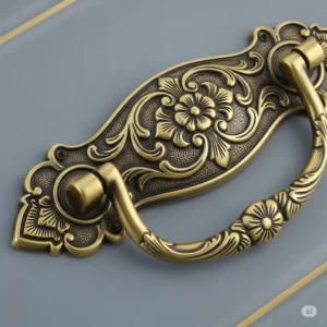 Intricately designed antique brass drawer pull, perfect for vintage antique brass kitchen hardware.