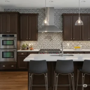 Stylish kitchen featuring dark wood cabinets complemented by a striking black and white patterned backsplash, creating a dramatic and sophisticated look.