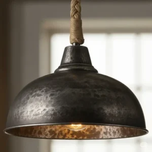 Close-up of a rustic metal pendant light, perfect for adding a farmhouse touch above a kitchen island. This is an example of farmhouse kitchen island lighting.