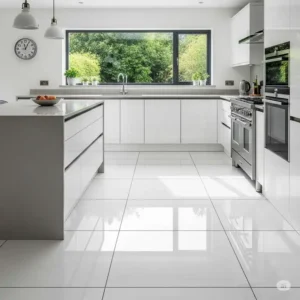 Contemporary kitchen with white kitchen floor tiles contrasted by dark grout lines, highlighting the tile pattern and adding definition.