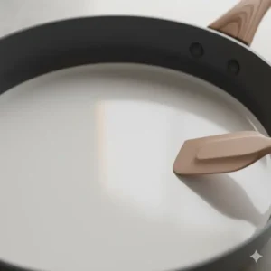 Close-up view of the smooth, non-stick ceramic coating inside a 14 inch ceramic skillet, highlighting easy food release. 