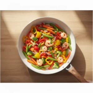 Top-down perspective of a 14 inch ceramic skillet, emphasizing the generous cooking area for family-sized portions. 