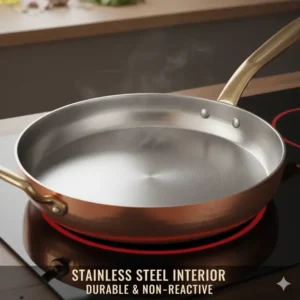 Close-up of the durable stainless steel lining inside a copper skillet pan.