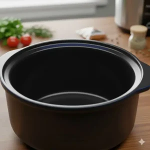 Close-up of a high-quality, US-made ceramic inner pot for a Crockpot, showing non-stick surface.