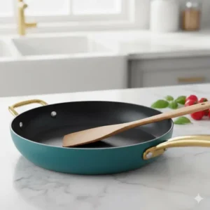 Close-up of the professional non-stick surface of a teal pots and pans set.