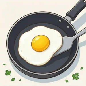 An over-easy fried egg flipped over to lightly cook the top white while keeping the yolk perfectly runny.
